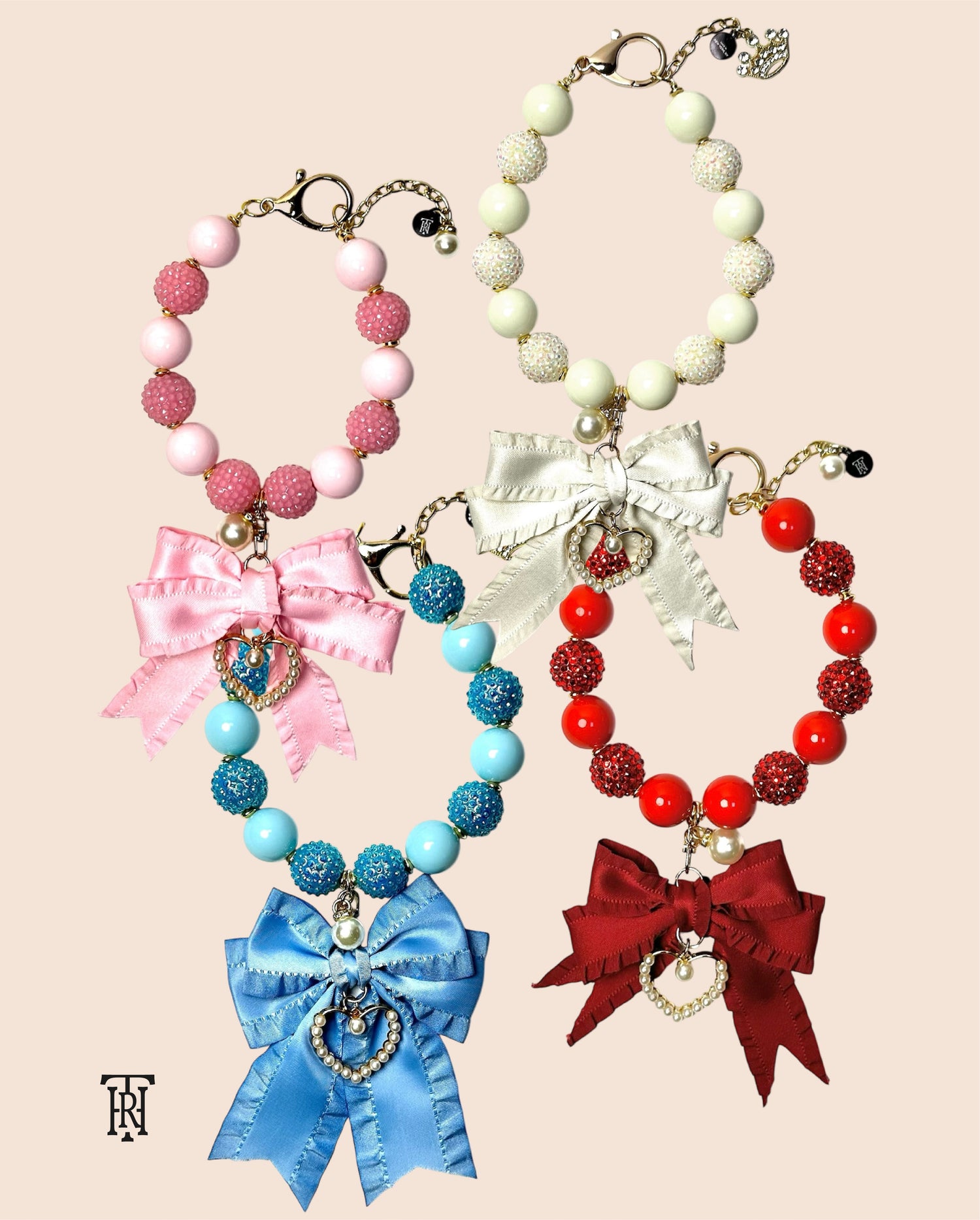 The Haus Royale's bows collection for pet's necklaces that comes in white, red, pink, and blue.