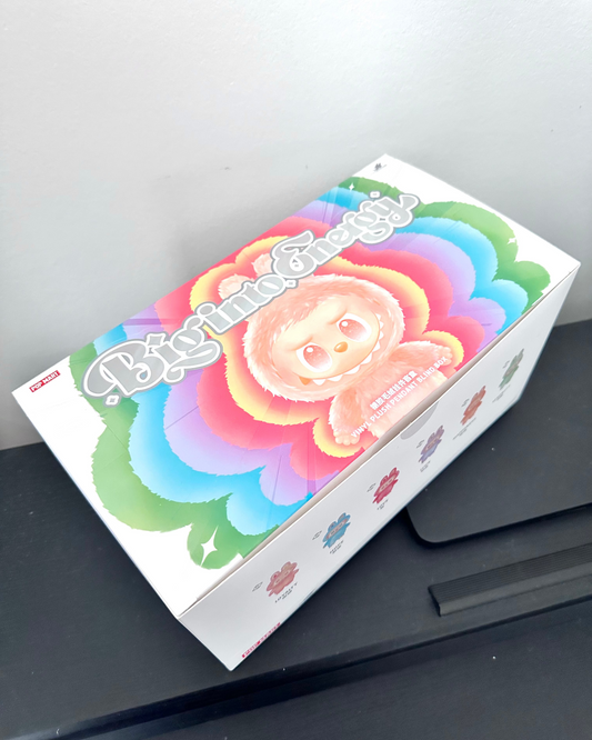 Colorful box with cartoon character on a gray surface