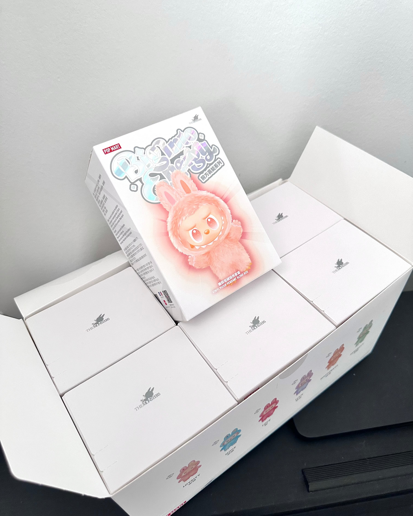 Unboxed toy with packaging on a gray surface
