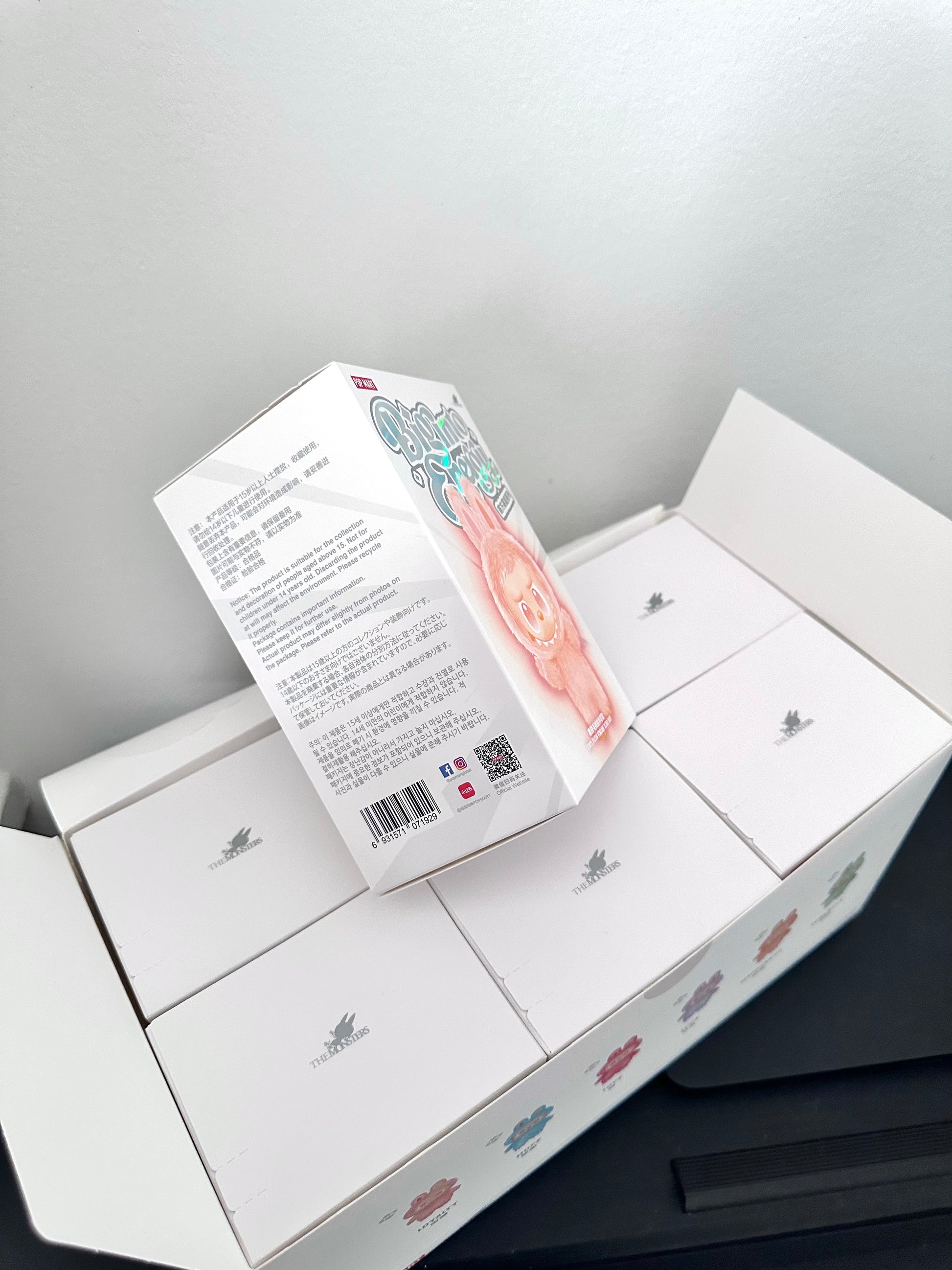 Product packaging with text and a barcode on a gray background