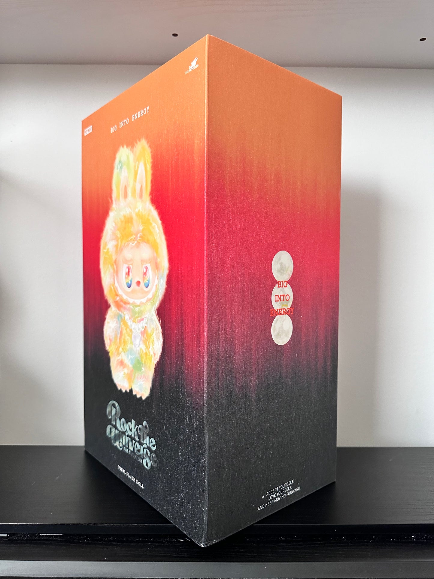 Product packaging with a gradient design and brand logo on a white background