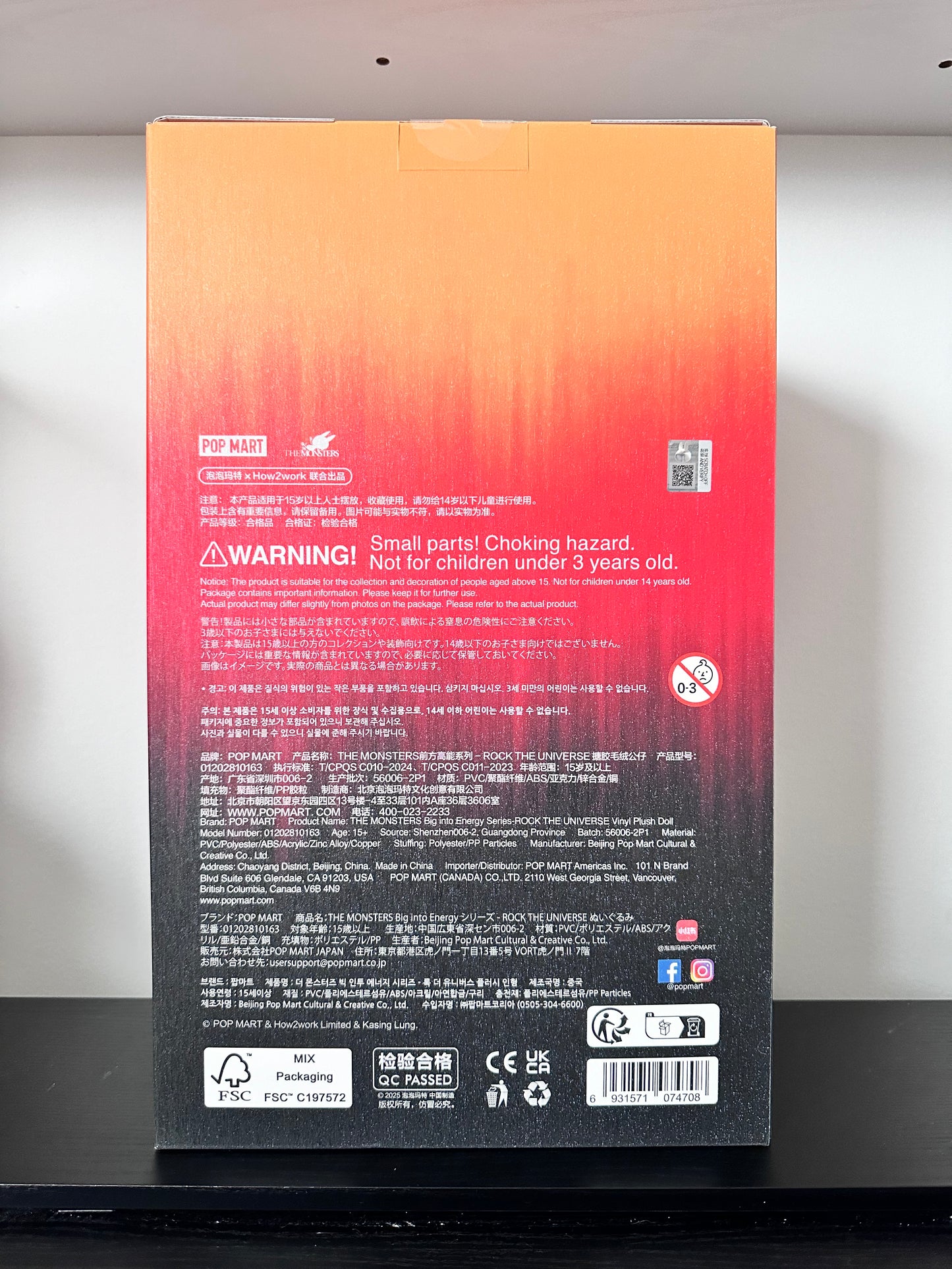 Back view of a product packaging with text and symbols on a gradient background