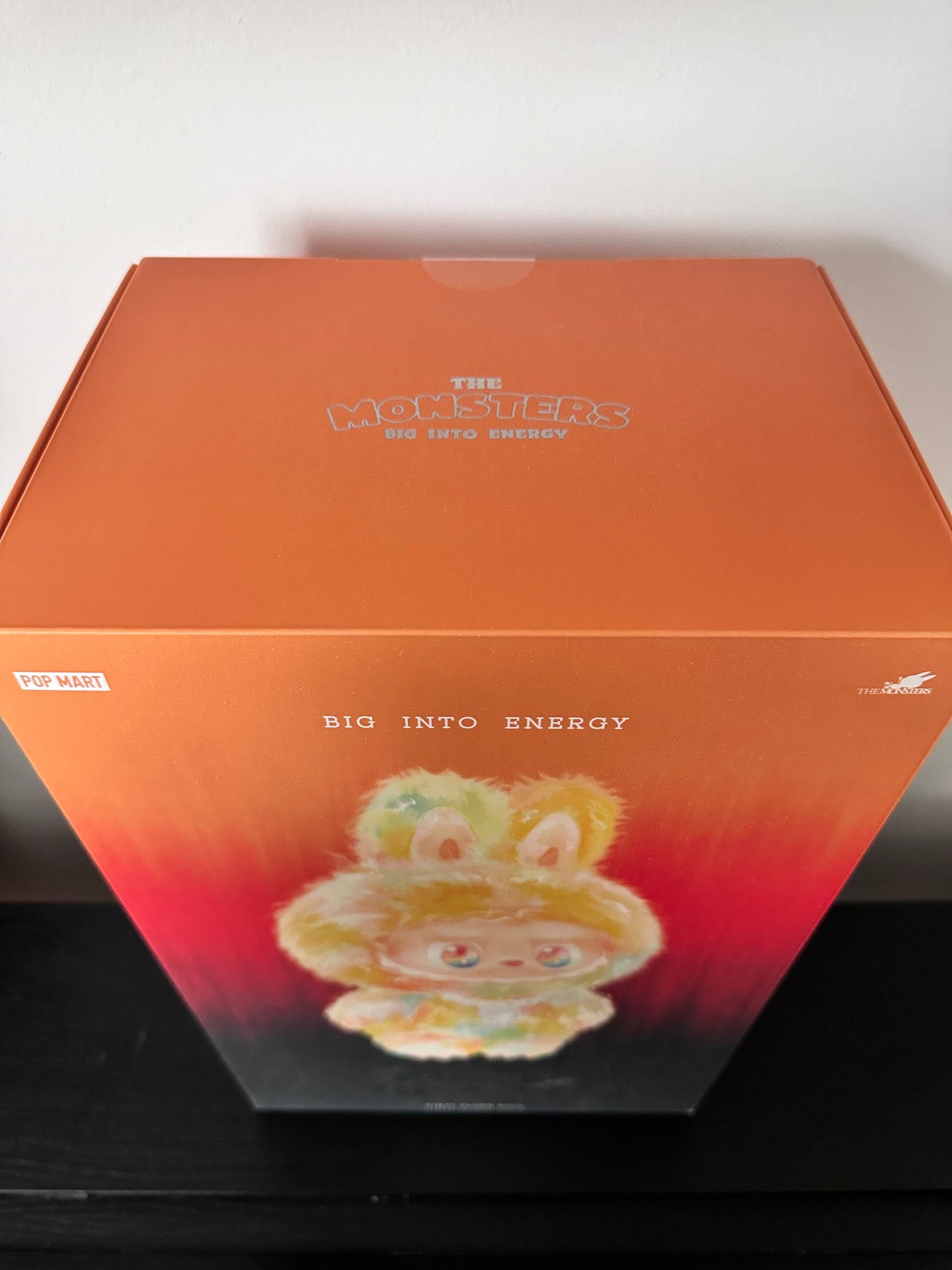Orange box with a colorful design on a white background