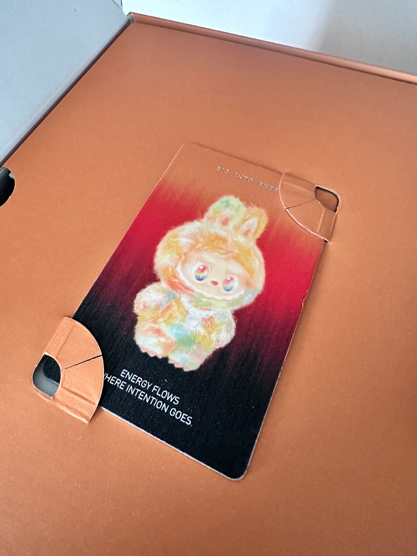 Card with floral design on a brown surface
