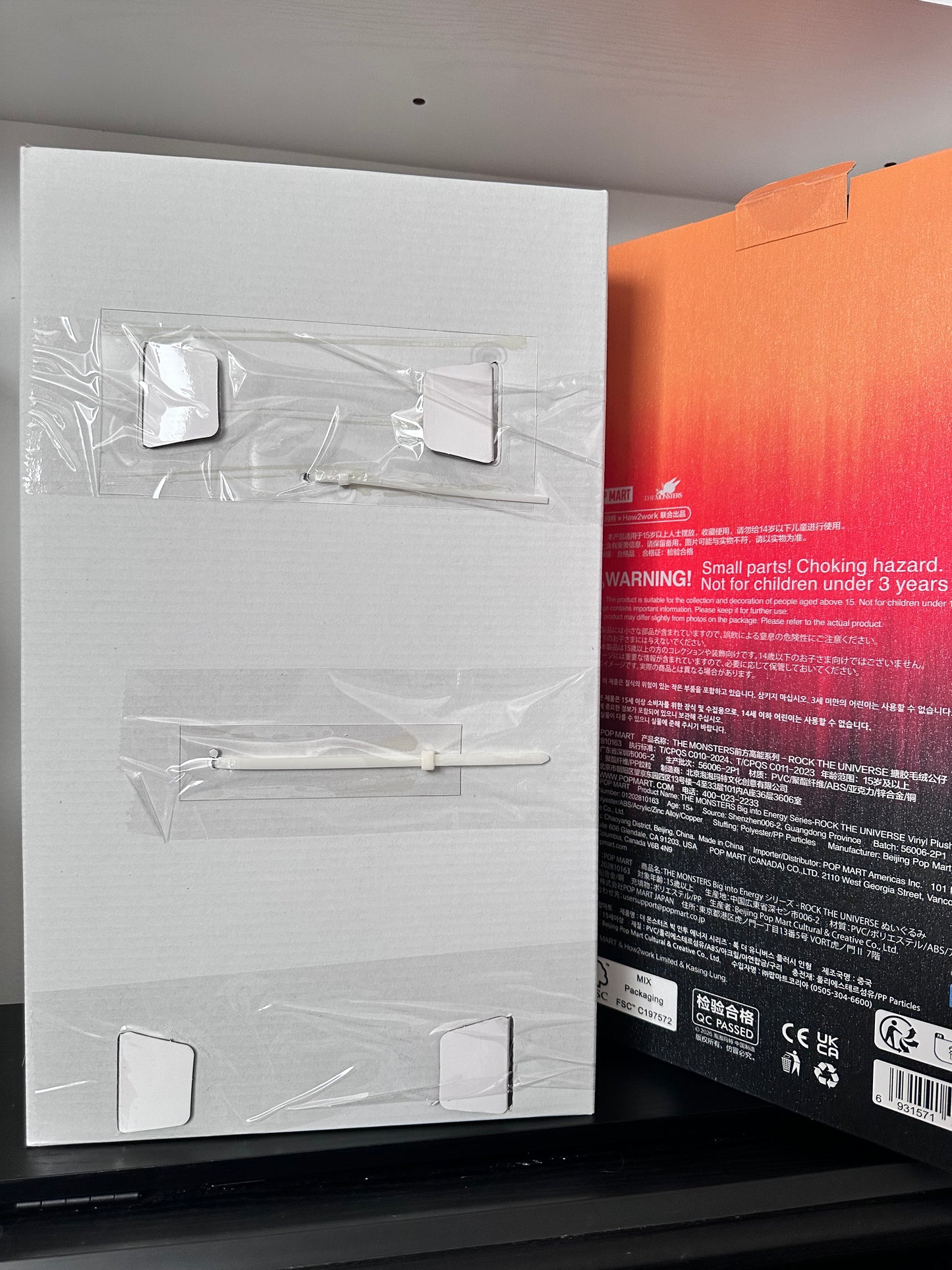 Product packaging with clear plastic covers on a white surface