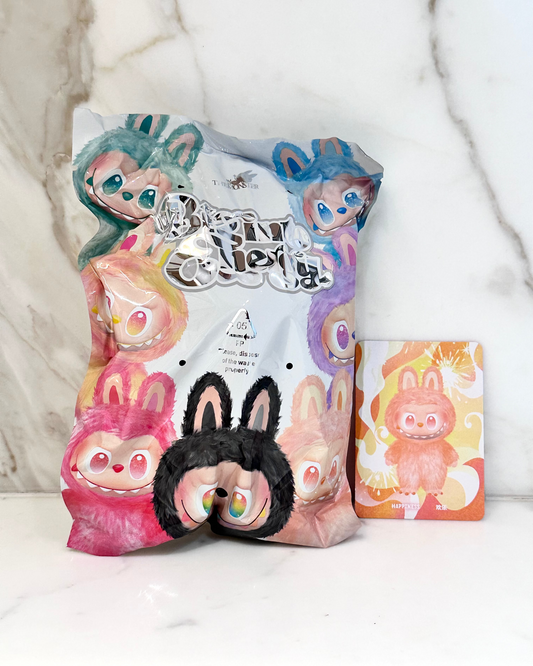 Cartoon character plush toy with packaging on a white background