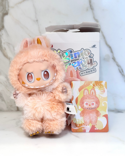 Plush toy with packaging on a light background