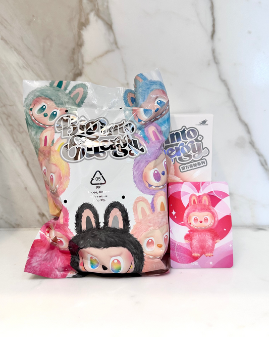 Two cartoon-themed product packages on a marble surface