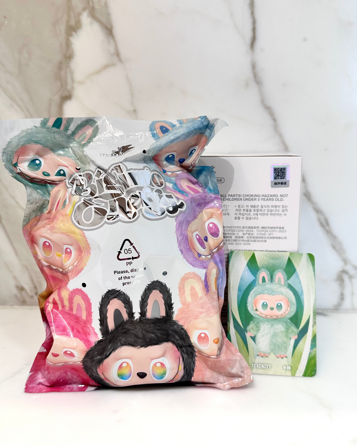 Animated character plush toy with packaging on a white background