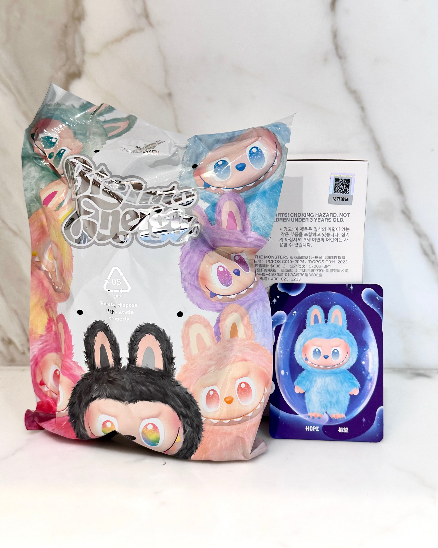 Packaged toy with colorful characters on a white background