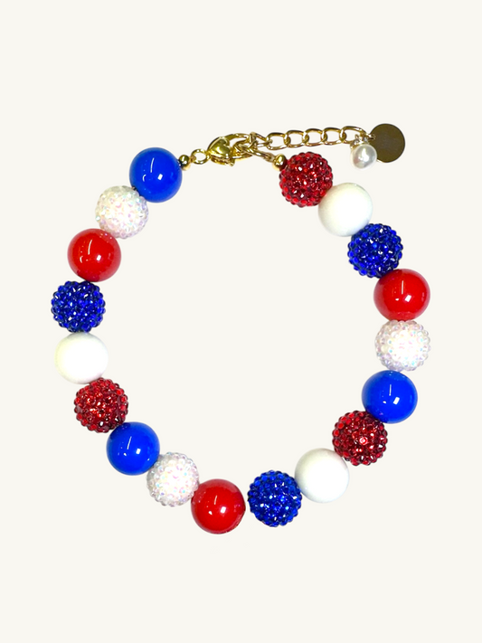 A pet luxury beaded necklace handmade in New York City in red, white, and blue fas part of The Haus Royale's The Americana collection