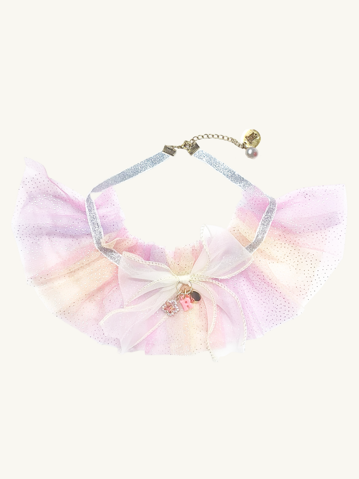 Pastel-colored bow with a chain on a white background