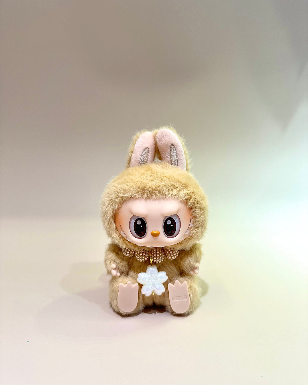 Toy figure of a character wearing a bunny costume on a light background