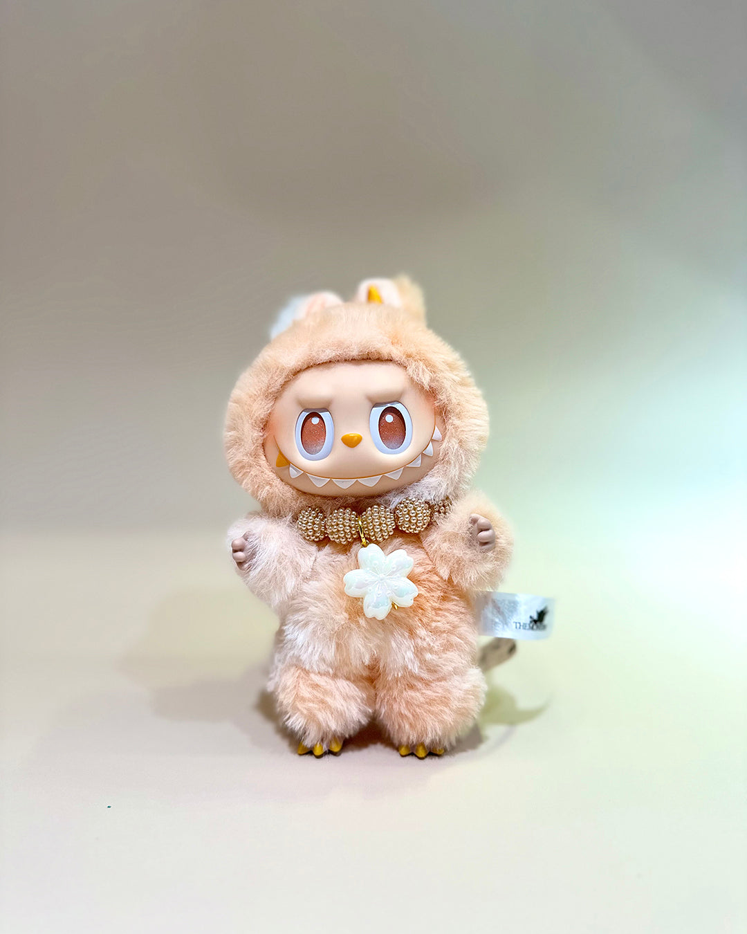 Plush toy with a cute design on a plain background