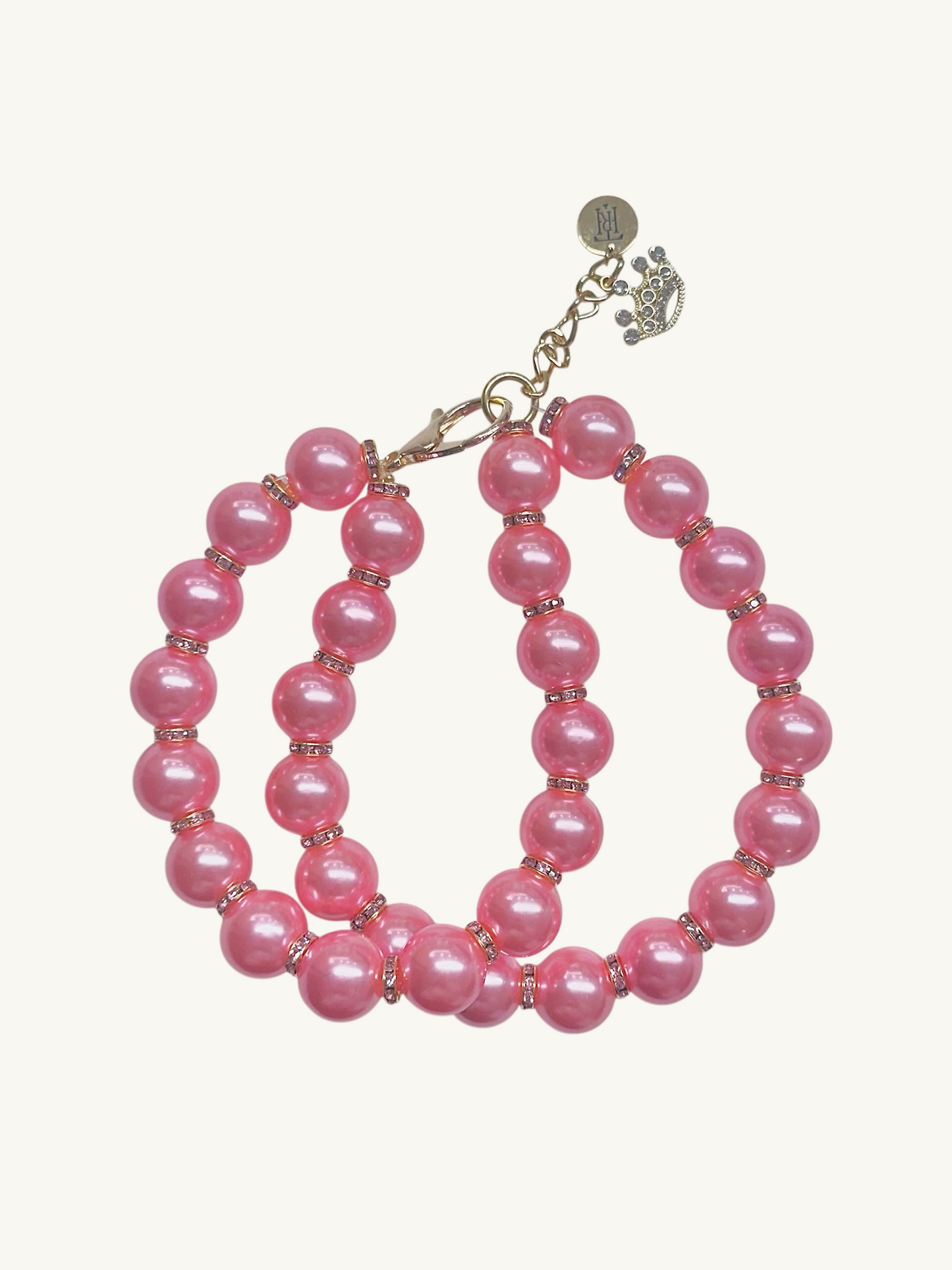 Set of pink beaded hoop earrings on a white background