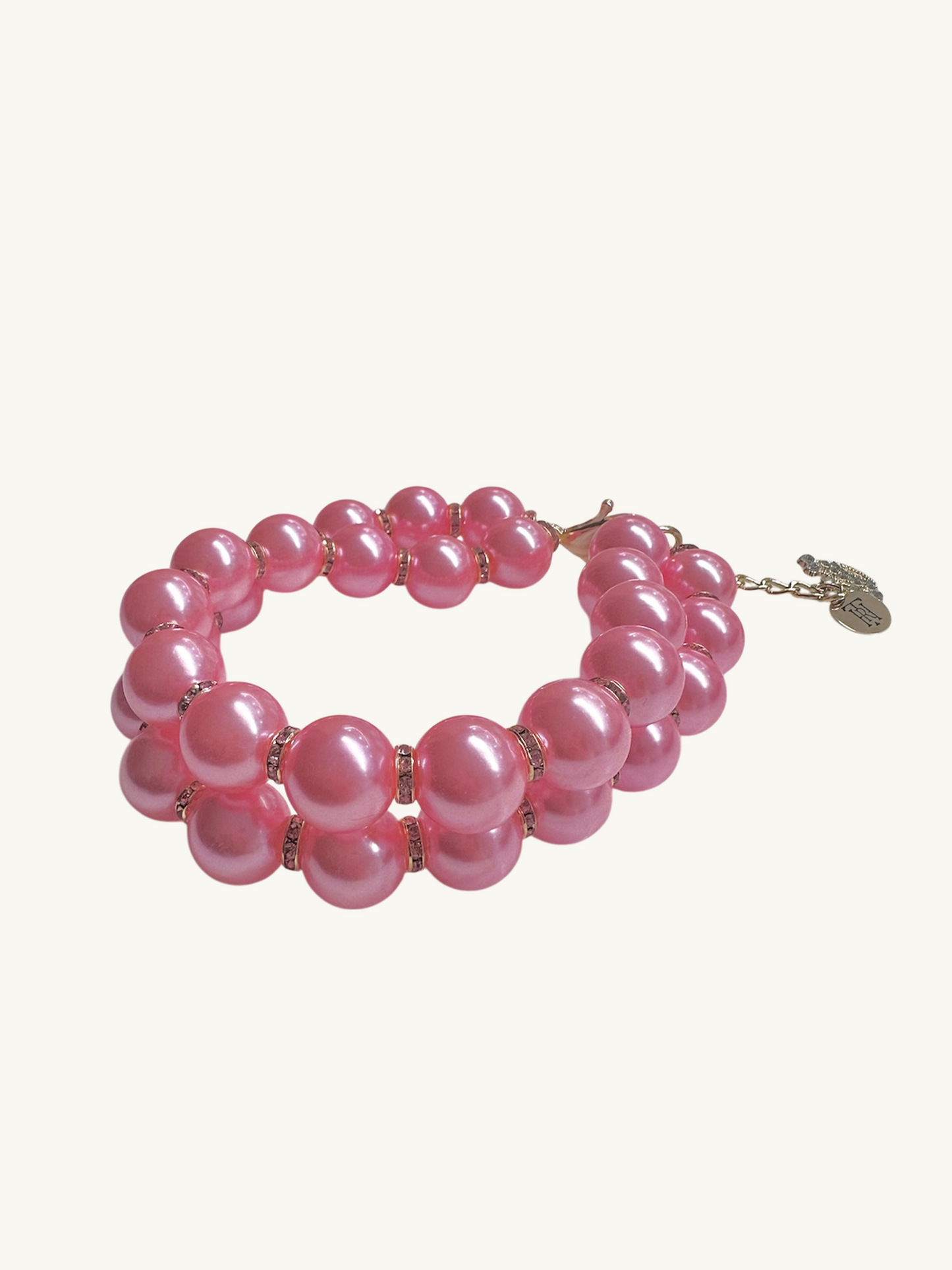 Pink beaded bracelet on a white background
