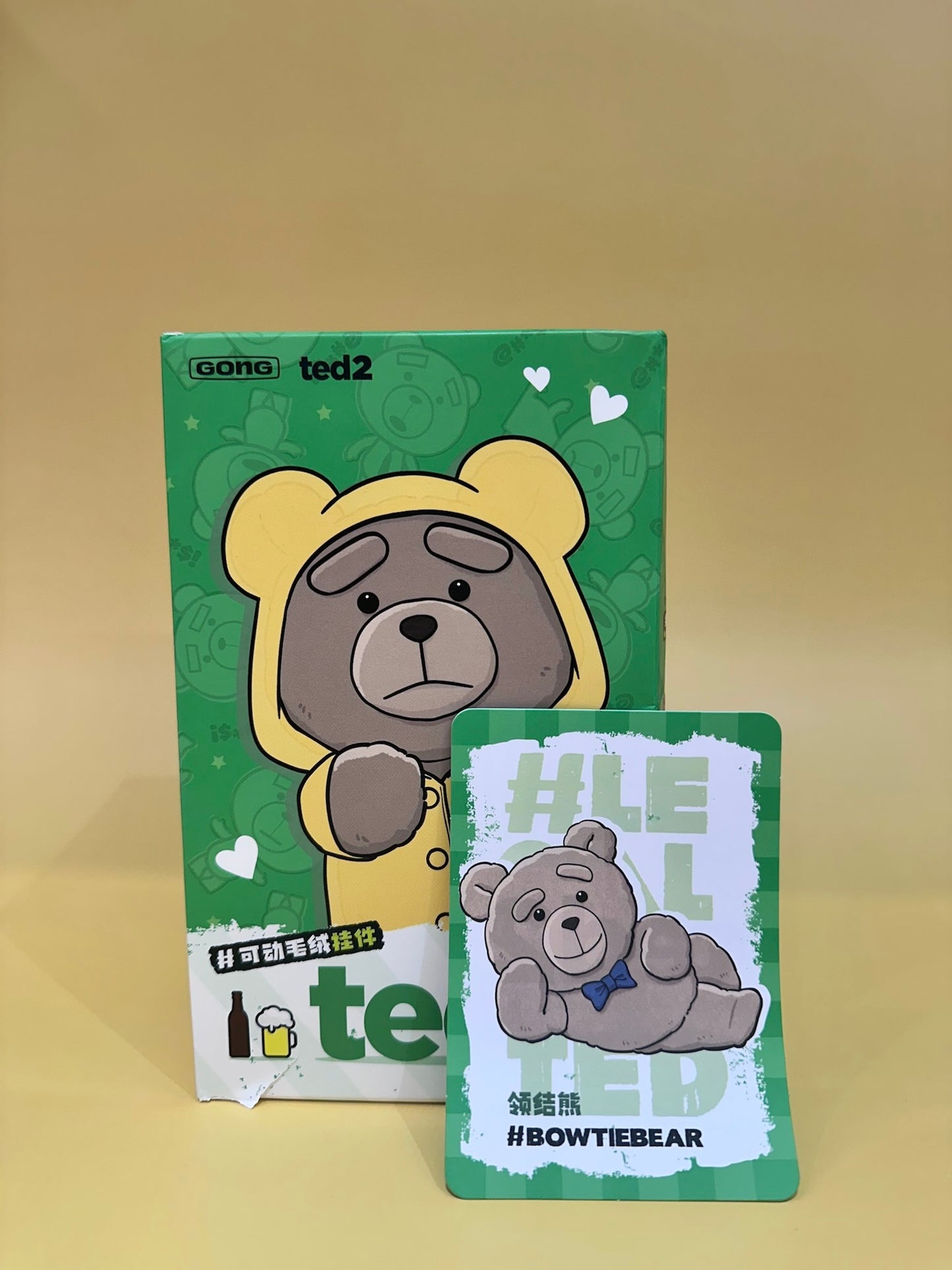 Two green cards featuring cartoon bears on a beige background