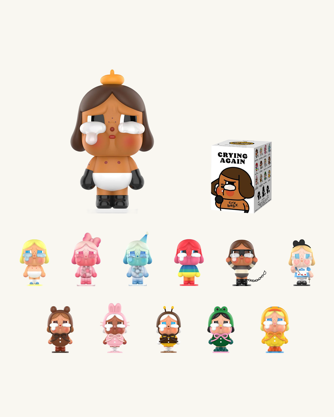 Collection of small figurines with a box labeled 'Crying Again' on a white background