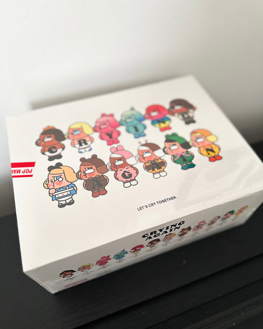 Box with cartoon character designs and text on a white background