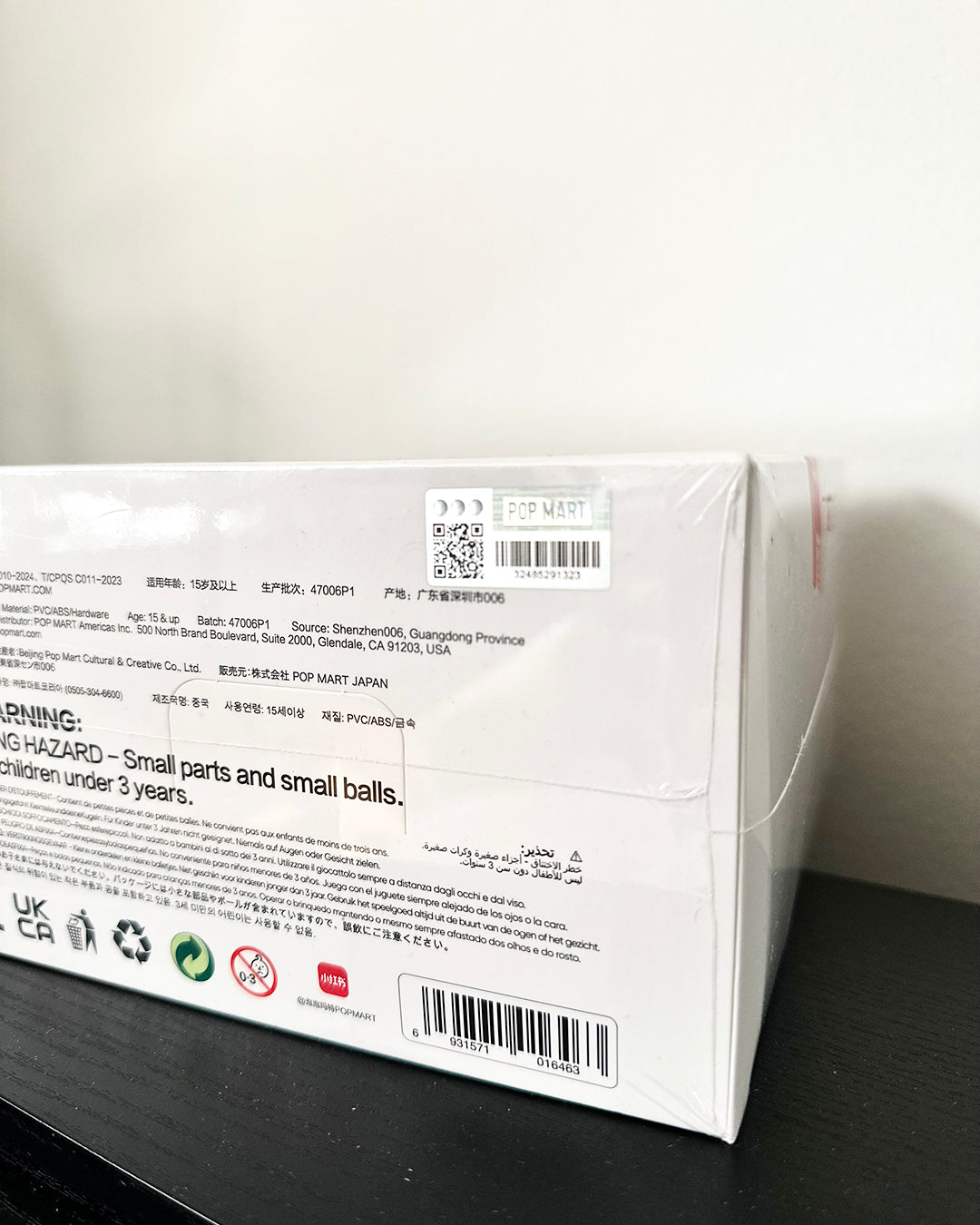 Product packaging with text and barcodes on a white background