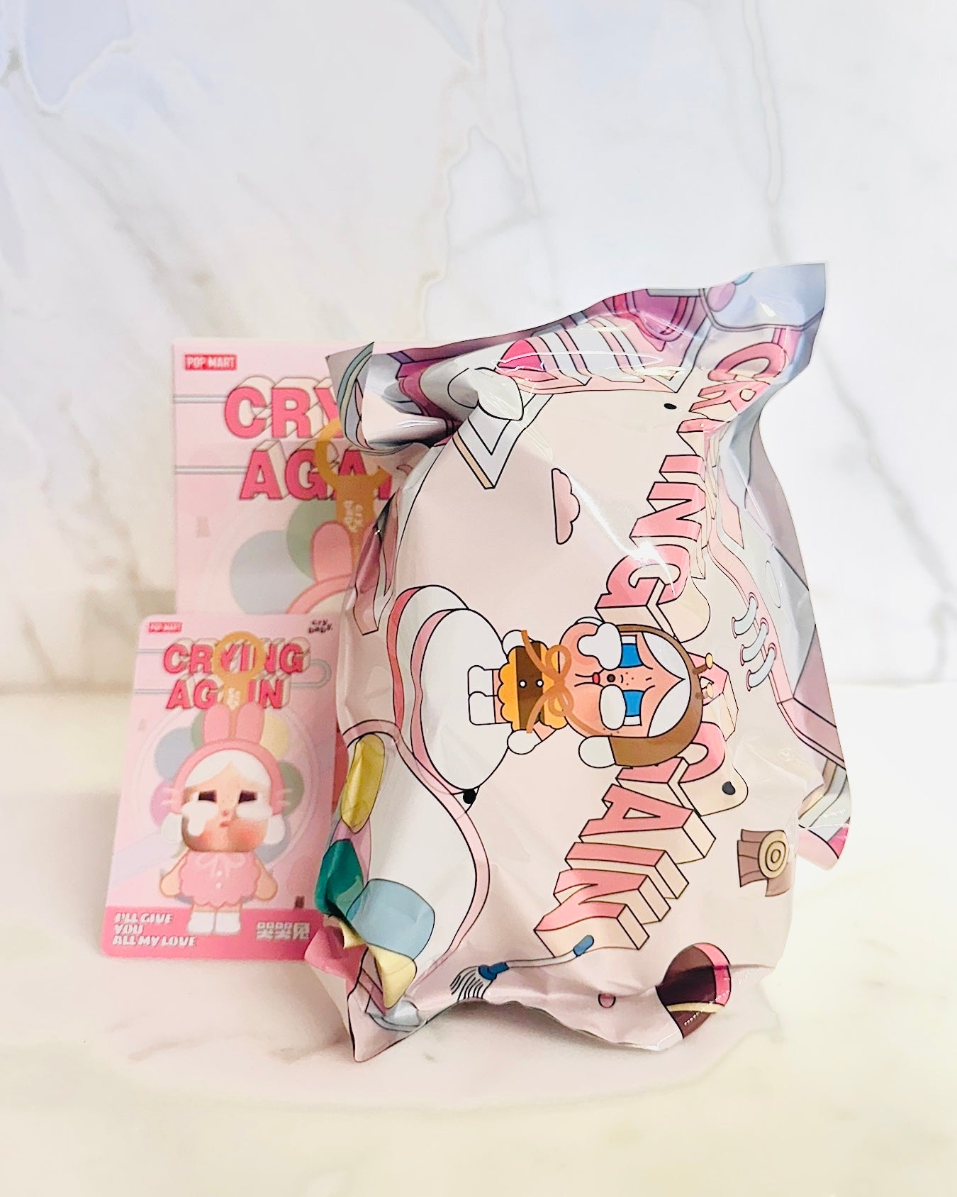 Crying Again puzzle packaging with cartoon character on a light background