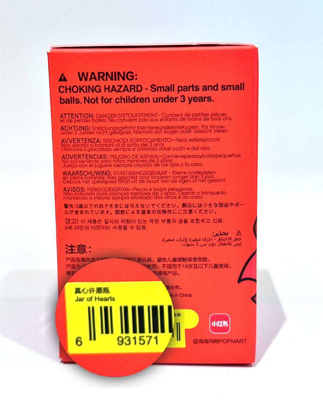 Product packaging with warning label and barcode on a white background