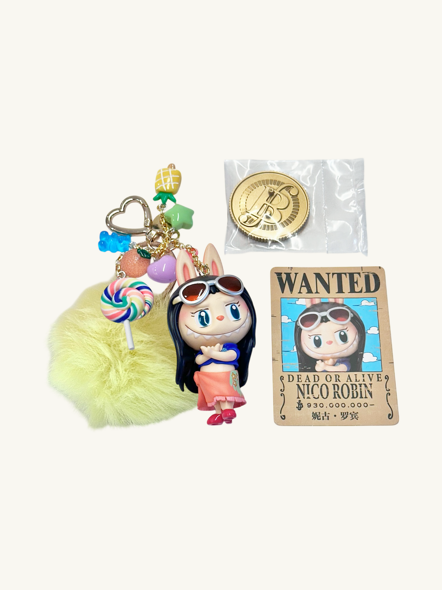 Keychain with character design, lollipop charm, and 'Wanted' poster on a white background