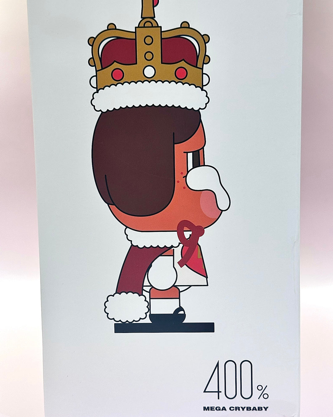 Cartoon character with a crown and '400% Mega Crybaby' text on a light gray background