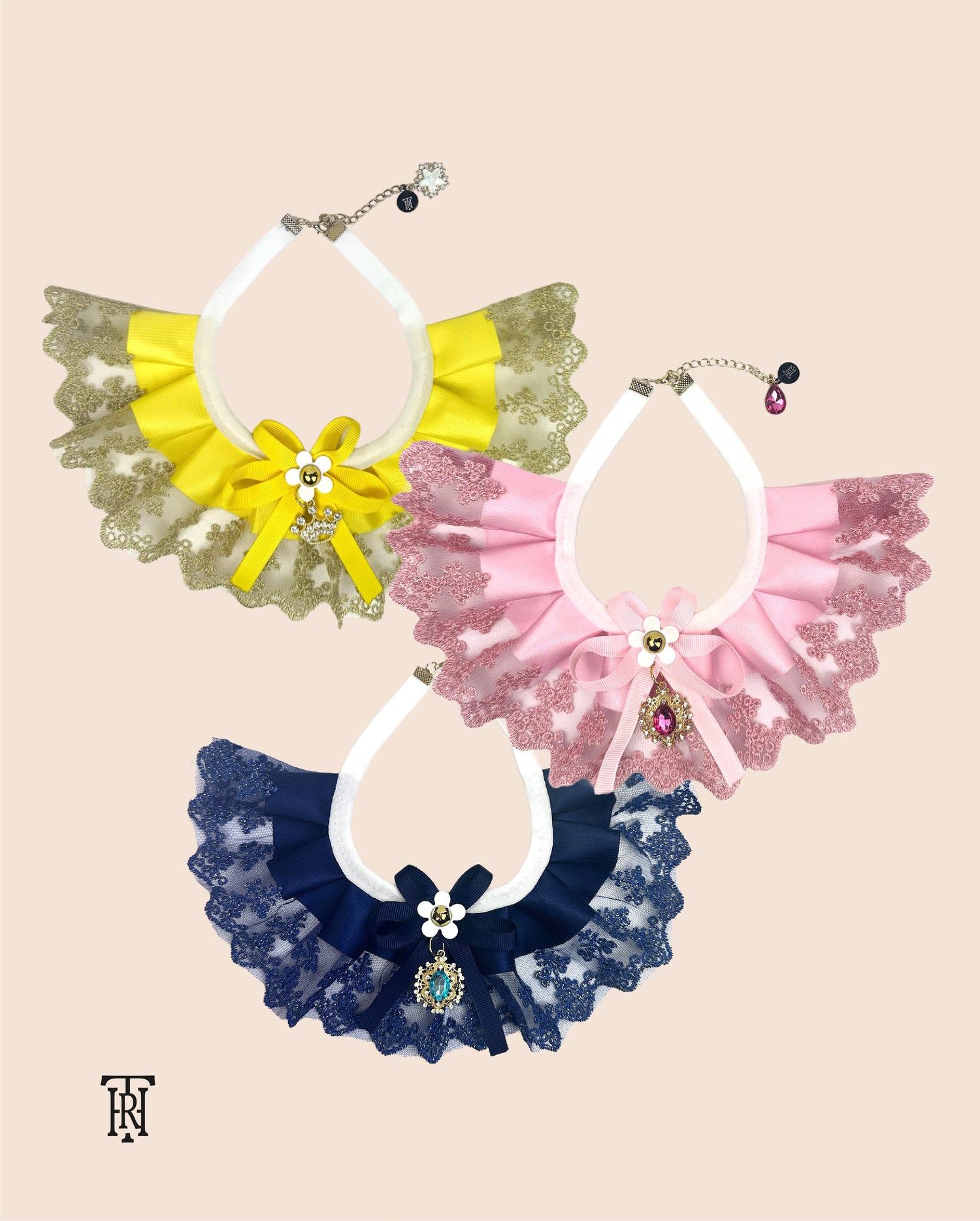 The Haus Royale's lace bib pet collars that comes in blue, pink, and yellow colors.