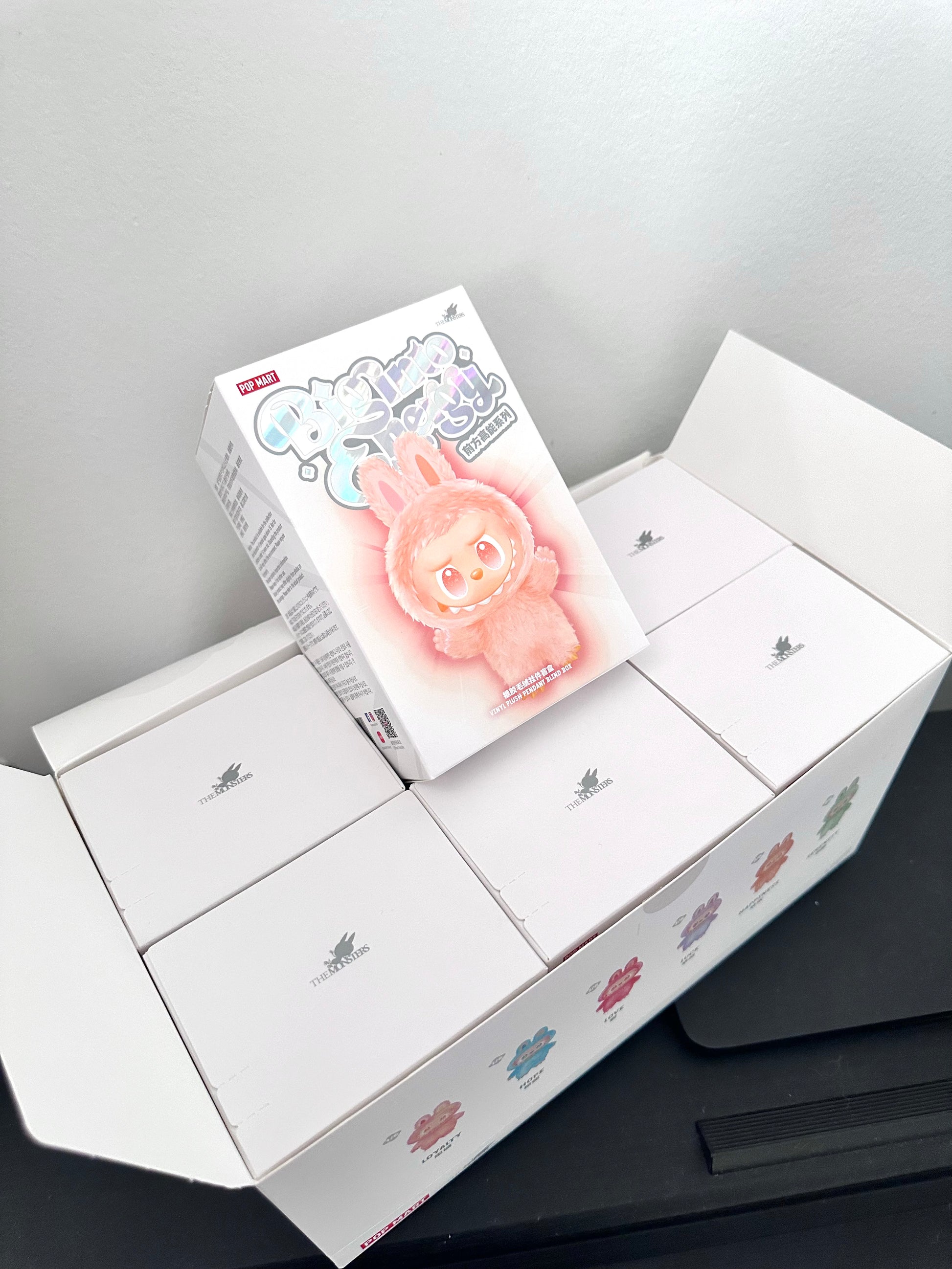 Unboxed toy with packaging on a gray surface