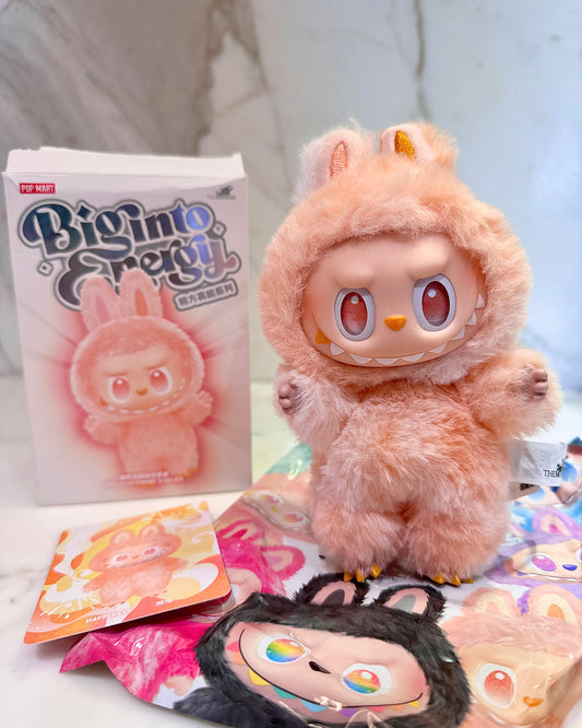 Plush toy with packaging and additional items on a light background