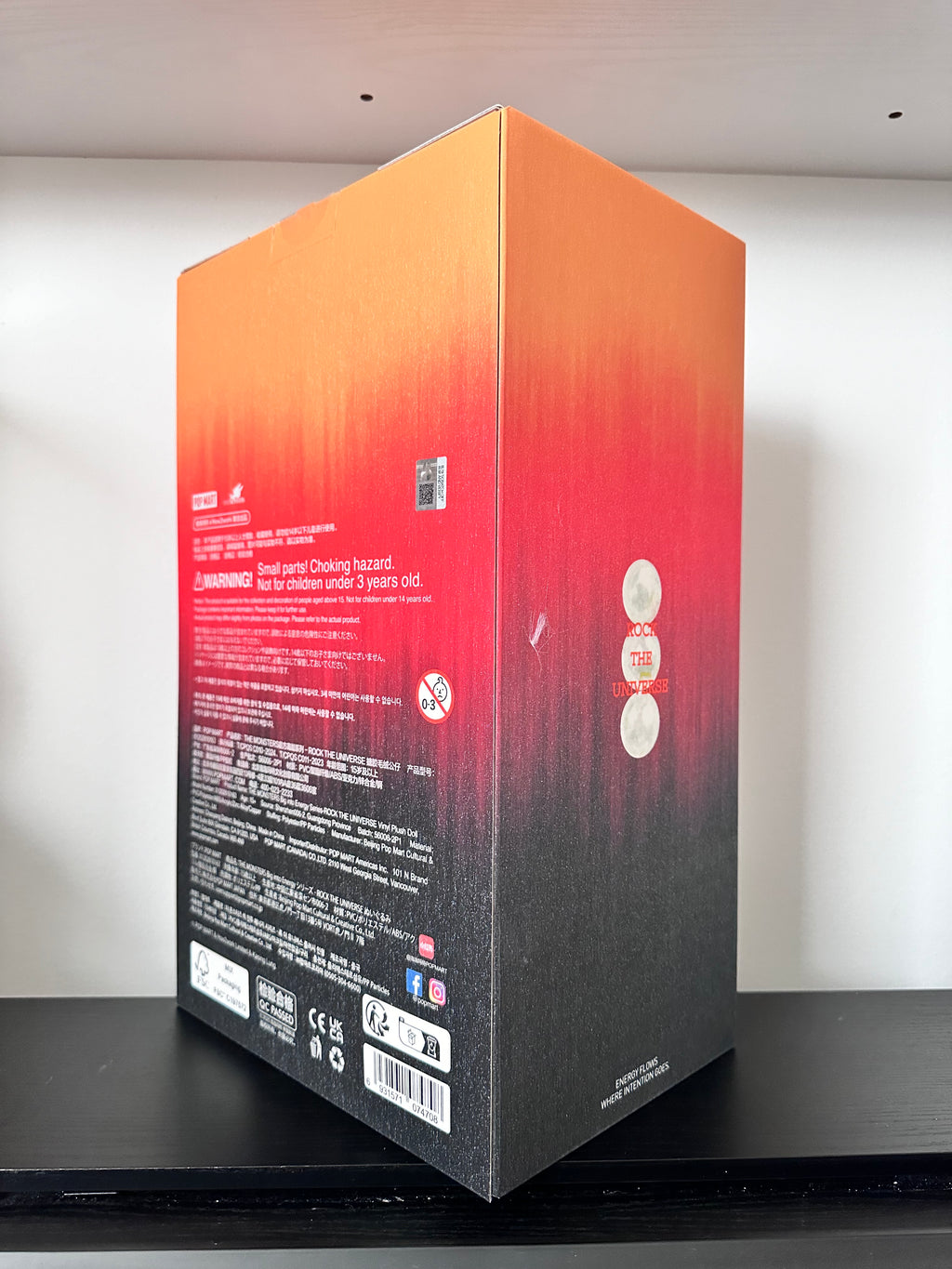 Gradient box with red and black design on a white background