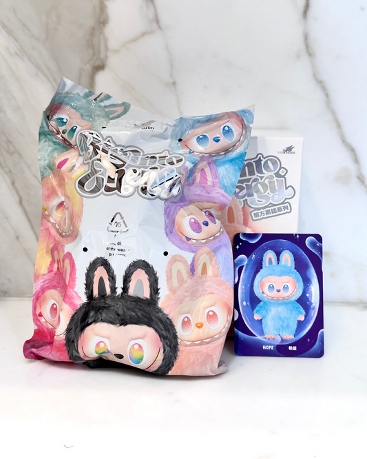 Plush toys and packaging with colorful designs on a white background