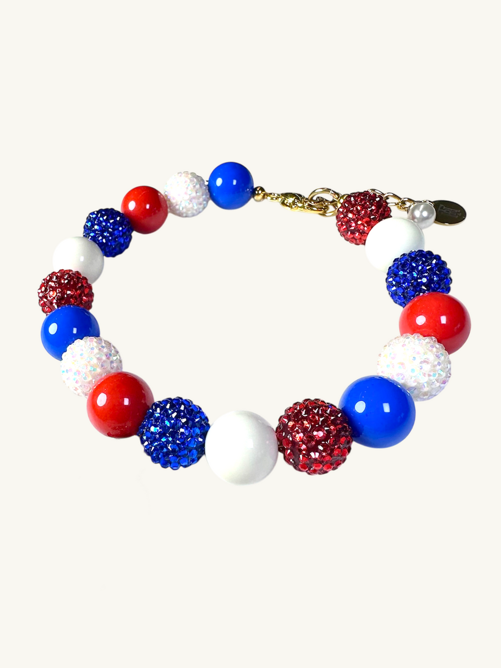 A pet luxury beaded necklace handmade in New York City in red, white, and blue fas part of The Haus Royale's The Americana collection