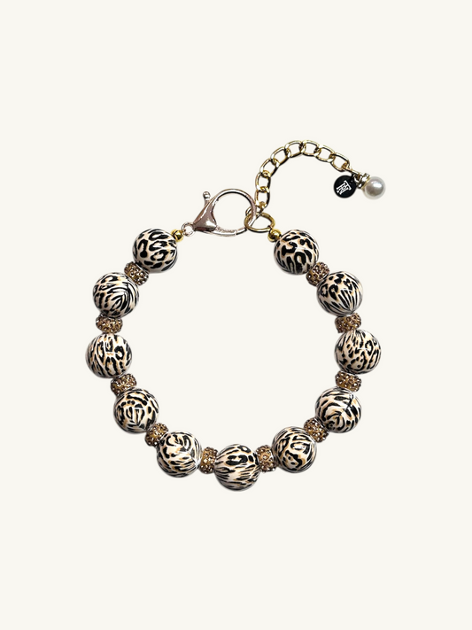 Bracelet with patterned beads on a white background