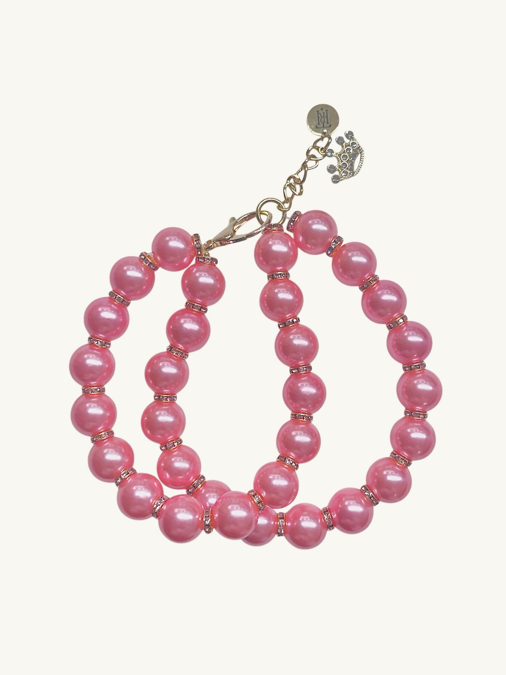 Set of pink beaded hoop earrings on a white background