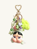 Colorful keychain with a character design on a white background