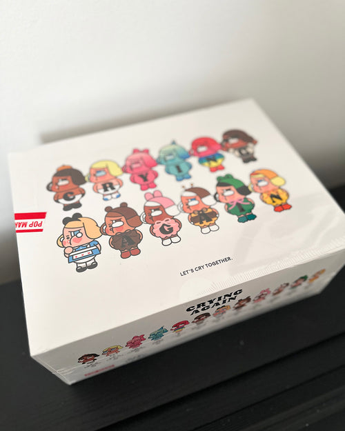 Box with cartoon character designs and text on a white background