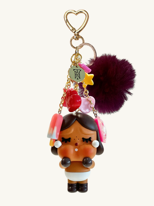 Colorful keychain with a character design on a white background