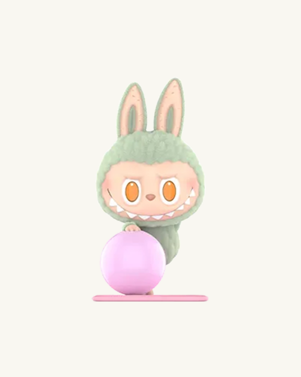 Plush toy with bunny ears and a pink ball on a white background