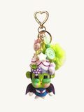 Colorful character keychain with decorative elements on a white background