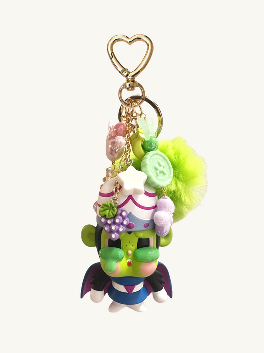 Colorful character keychain with decorative elements on a white background