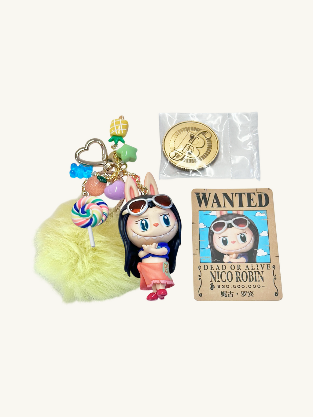 Keychain with character design, lollipop charm, and 'Wanted' poster on a white background