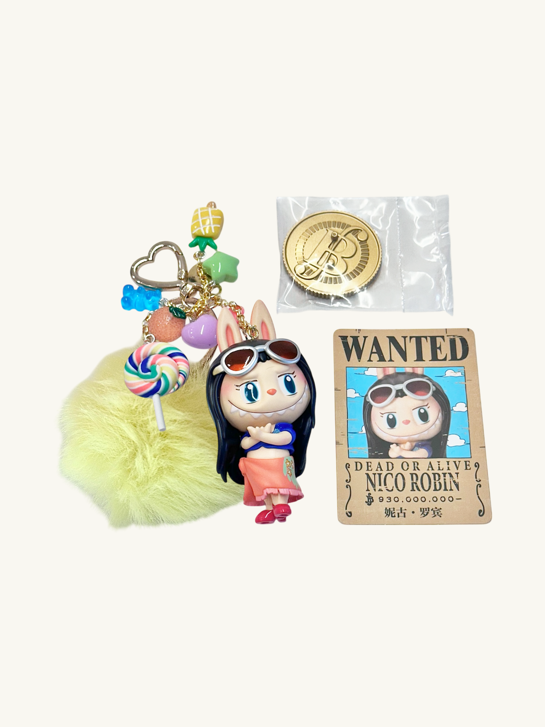 Keychain with character design, lollipop charm, and 'Wanted' poster on a white background