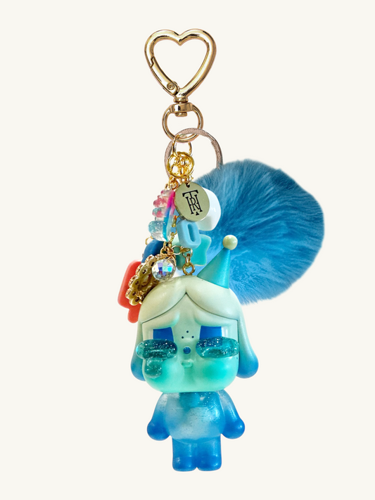 Colorful keychain with a character design on a white background