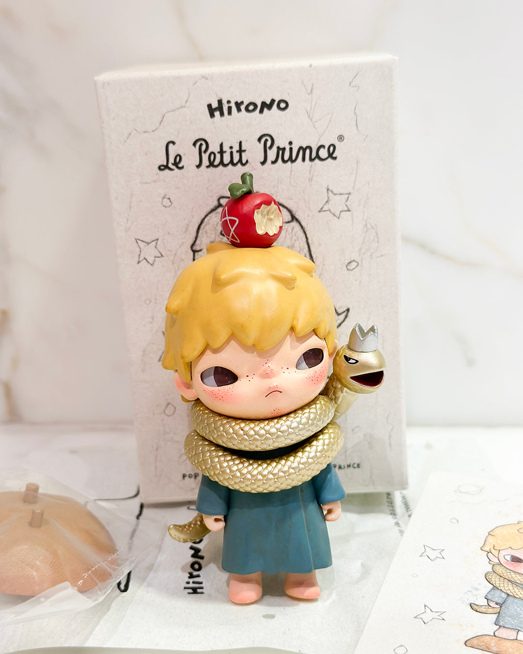 Toy figure of a character from 'Le Petit Prince' with a white background